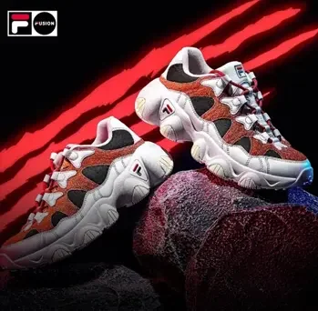 FILA Fusion sneakers on rocky terrain with red light streaks