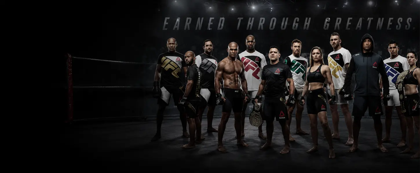 UFC fighters standing in Reebok competition apparel under arena lights