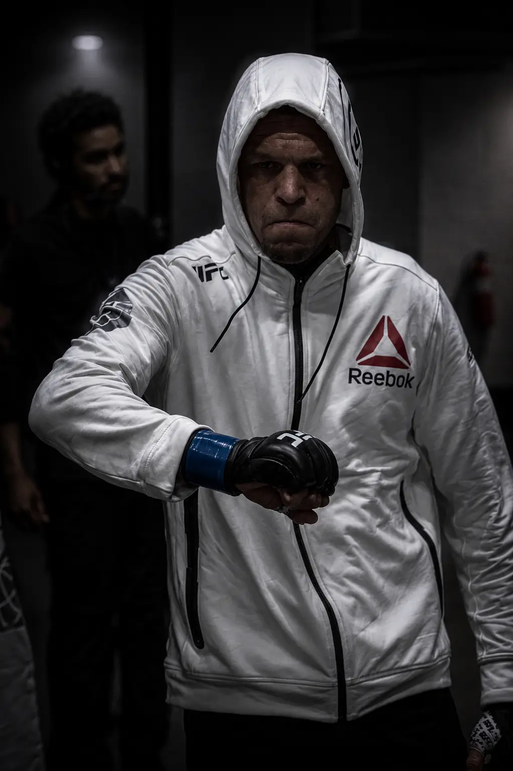 Fighter walking out in white UFC Reebok apparel